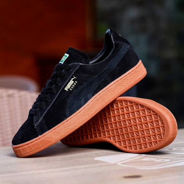 Puma negra best sale suela marron