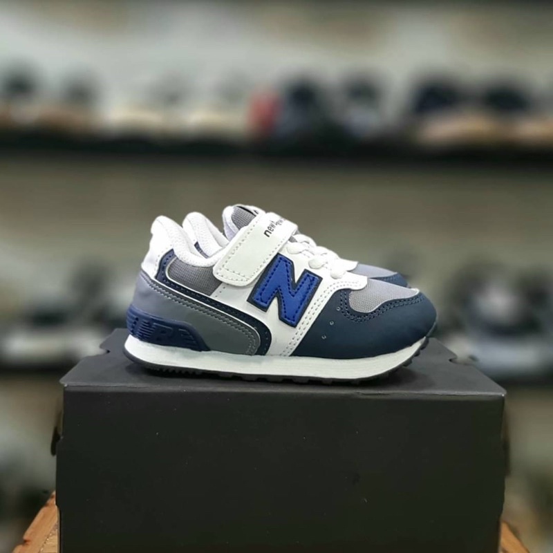 New balance niño blanco best sale