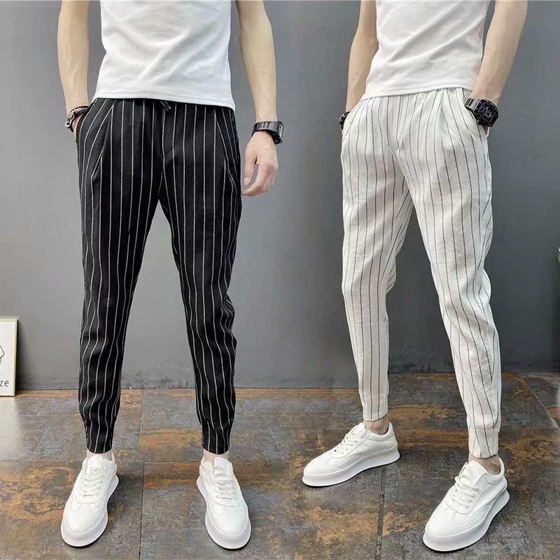 Pantalon blanco con rayas negras online hombre